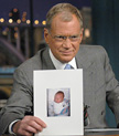 David Letterman shows off a pic of his baby boy